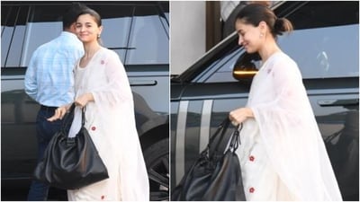 Alia accessorised the ensemble with minimal additions, including dainty jhumkis, Kolhapuri block heel sandals, and a black tote handbag. Muted pink lip shade, feathered brows, blushed cheeks, mo makeup, and a loose ponytail gave the finishing touch to Alia's airport look. (Instagram) Alia accessorised the ensemble with minimal additions, including dainty jhumkis, Kolhapuri block heel sandals, and a black tote handbag. Muted pink lip shade, feathered brows, blushed cheeks, mo makeup, and a loose ponytail gave the finishing touch to Alia's airport look. (Instagram)