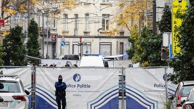 Brussels Shooting: A police officer stands guard in the street in the Schaerbeek area of Brussels. (AFP) Brussels Shooting: A police officer stands guard in the street in the Schaerbeek area of Brussels. (AFP)