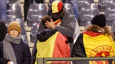 Supporters are on the stands after the suspension of the Euro 2024 group F qualifying soccer match between Belgium and Sweden at the King Baudouin Stadium in Brussels, on Monday (AP) Supporters are on the stands after the suspension of the Euro 2024 group F qualifying soccer match between Belgium and Sweden at the King Baudouin Stadium in Brussels, on Monday (AP)
