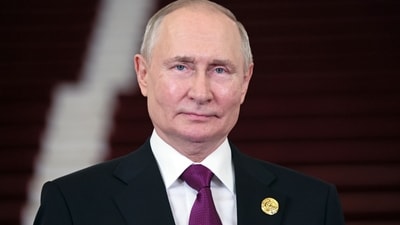 Russian president Vladimir Putin looks on. (AP)