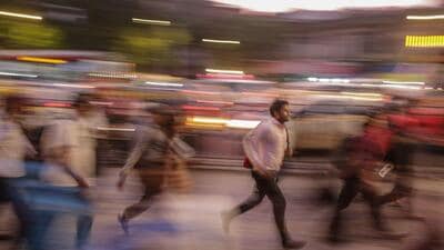 Commuters rush towards the Chhatrapati Shivaji Terminus (CST) train station at dusk in Mumbai, India, on Wednesday (Bloomberg File) Commuters rush towards the Chhatrapati Shivaji Terminus (CST) train station at dusk in Mumbai, India, on Wednesday (Bloomberg File)