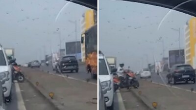 The image shows a biker trying to ride on the divider to avoid traffic. (Instagram/@mumbaipolice) The image shows a biker trying to ride on the divider to avoid traffic. (Instagram/@mumbaipolice)