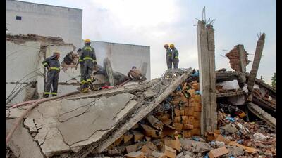 Police personnel and firefighters at the site after an explosion at a soap-making factory, at Lohia Nagar in Meerut on Tuesday. (PTI Photo)