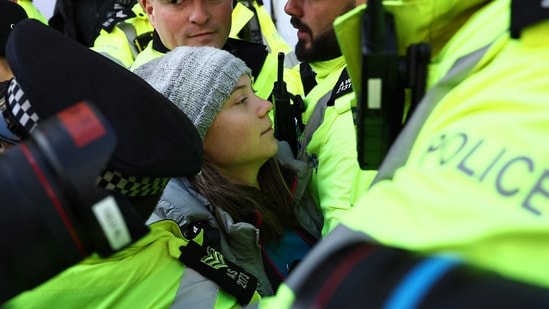 Swedish climate activist Greta Thunberg is arrested by police outside the InterContinental London Park Lane. (AFP)