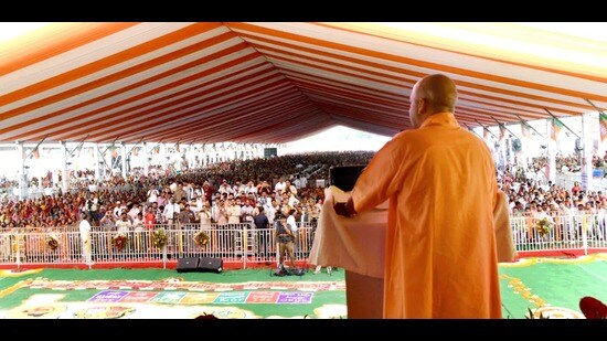 Chief minister Yogi Adityanath addressing the gathering while inaugurating/laying the foundation stone of 256 development projects worth ₹ 632 crore in Bulandshahr district on Tuesday. (HT)