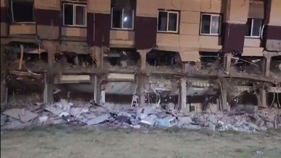 The hotel belonging to the gangster-turned-politician being demolished on the intervening night of Monday and Tuesday. (Photo from X.)
