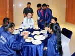 Union Minister for Home Affairs Amit Shah interacts with tribal youth under the Tribal Youth Exchange Program (TYEP), in Delhi on Wednesday. 