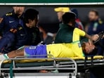 Brazil's Neymar is brought off the pitch after sustaining an injury