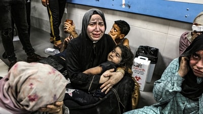 Wounded Palestinians sit in al-Shifa hospital in Gaza City, central Gaza Strip, after arriving from al-Ahli hospital following an explosion there, Tuesday, Oct. 17, 2023. (AP) Wounded Palestinians sit in al-Shifa hospital in Gaza City, central Gaza Strip, after arriving from al-Ahli hospital following an explosion there, Tuesday, Oct. 17, 2023. (AP)