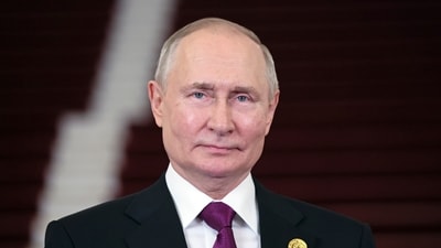 Russian president Vladimir Putin looks on. (AP)