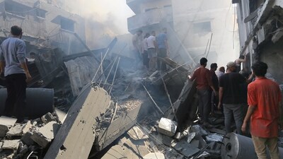 Israel-Hamas War: Palestinians look for survivors after Israeli airstrikes in Gaza City, Gaza Strip. (AP) Israel-Hamas War: Palestinians look for survivors after Israeli airstrikes in Gaza City, Gaza Strip. (AP)