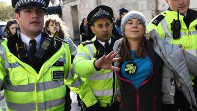 Swedish climate activist Greta Thunberg is arrested outside the InterContinental London Park Lane. (AFP) Swedish climate activist Greta Thunberg is arrested outside the InterContinental London Park Lane. (AFP)