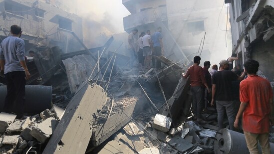 Israel-Hamas War: Palestinians look for survivors after Israeli airstrikes in Gaza City, Gaza Strip. (AP)