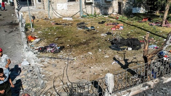 Israel-Hamas War: People walking at the site of the Ahli Arab hospital in central Gaza. (AFP)
