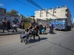 Palestinians flee on foot from Gaza City to southern Gaza after being told to leave their homes in the north by the Israeli military in the Gaza Strip on October 13. Palestinians flee on foot from Gaza City to southern Gaza after being told to leave their homes in the north by the Israeli military in the Gaza Strip on October 13.