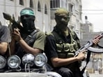 Palestinian militants from Hamas ride on a truck with their weapons in 2007. Palestinian militants from Hamas ride on a truck with their weapons in 2007.