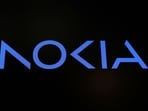 A screen displays the company logo for Nokia Corporation