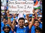 Man holding up a placard during the Cricket World Cup 2023 match between India and Bangladesh. 
