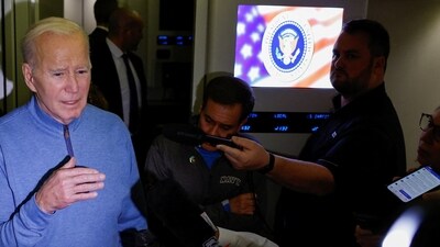 US President Joe Biden speaks to the press onboard of Air Force One en route from Israel, amid the ongoing war between Israel and Hamas, at Ramstein Air Base in Germany, October 18. (REUTERS)