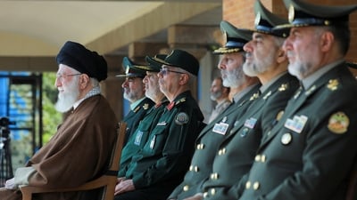 Iran's Supreme Leader Ayatollah Ali Khamenei (wearing brown) (via REUTERS)