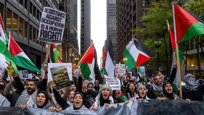 Thousands of pro-Palestinian and Palestinian Americans march towards the Israeli Consulate during a protest in Chicago on October 18, (AP)