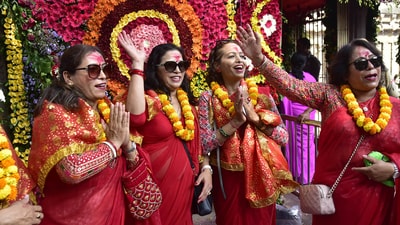 The Durga Puja festival, which spans over a fortnight, commenced at the Kamakhya temple with priests conducting rituals and reciting sacred slokas. Devotees from Nepal offer prayers at the Kamakhya temple during ongoing Navratri festival in Guwahati. (PTI)