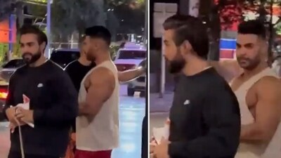 A viral video shows two men, one of whom has been identified as Dr. Ahmed ElKoussa, taking down posters of the hostages (@StopAntisemites/X)