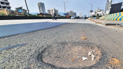 Thane, India - October,18, 2023: Within 9 months from inauguration of the famous Kopri Bridge, it is once again riddled with potholes and patchwork, exposing the shoddy work of government as well as MMRDA ,in Thane, in Mumbai, India, on, Wednesday, October ,18, 2023. ( Praful Gangurde / HT Photo ) Thane, India - October,18, 2023: Within 9 months from inauguration of the famous Kopri Bridge, it is once again riddled with potholes and patchwork, exposing the shoddy work of government as well as MMRDA ,in Thane, in Mumbai, India, on, Wednesday, October ,18, 2023. ( Praful Gangurde / HT Photo )