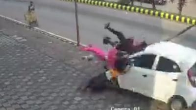 Speeding car rams into people walking on footpath in Mangaluru, one dead. Video Speeding car rams into people walking on footpath in Mangaluru, one dead. Video