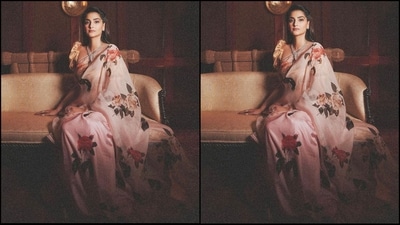 Sonam's blush pink sari features an organza fabric adorn with mélange of flowers from the Indian subcontinent that are printed all-over and highlighted with hand-embroidery. The sari has a sheer silk edging along the borders. She paired it up with a golden puff sleeves blouse. (Instagram/@sonamkapoor) Sonam's blush pink sari features an organza fabric adorn with mélange of flowers from the Indian subcontinent that are printed all-over and highlighted with hand-embroidery. The sari has a sheer silk edging along the borders. She paired it up with a golden puff sleeves blouse. (Instagram/@sonamkapoor)