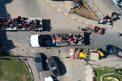Palestinians flee from northern Gaza to the south after the Israeli army issued an unprecedented evacuation warning on Oct. 13, 2023. (AP) Palestinians flee from northern Gaza to the south after the Israeli army issued an unprecedented evacuation warning on Oct. 13, 2023. (AP)