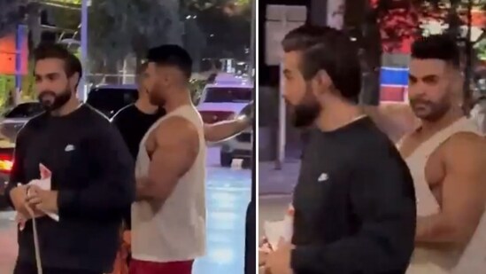 A viral video shows two men, one of whom has been identified as Dr. Ahmed ElKoussa, taking down posters of the hostages (@StopAntisemites/X)