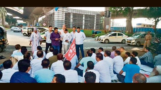 Taxi union and their drivers who operate prepaid taxis went on a dharna outside Mumbai airport on Thursday in Mumbai.