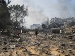Palestinians boy walks by the buildings destroyed in the Israeli bombardment on al-Zahra, on the outskirts of Gaza City. (AP) Palestinians boy walks by the buildings destroyed in the Israeli bombardment on al-Zahra, on the outskirts of Gaza City. (AP)