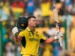 Australia's David Warner celebrates his century during the ICC Men's Cricket World Cup match between Australia and Pakistan in Bengaluru