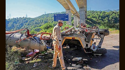 A policeman inspects the wreckage of a truck after it rolled down a bridge on the Jammu-Srinagar national highway at Jhajjar Kotli on Friday. At least four people were killed, according to officials. (PTI) A policeman inspects the wreckage of a truck after it rolled down a bridge on the Jammu-Srinagar national highway at Jhajjar Kotli on Friday. At least four people were killed, according to officials. (PTI)