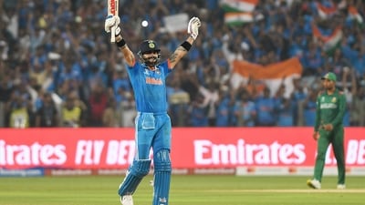 Pune, Oct 19 (ANI): India's Virat Kohli raises his bat after hitting the winning runs and also completing his century during their match against Bangladesh (ANI ) Pune, Oct 19 (ANI): India's Virat Kohli raises his bat after hitting the winning runs and also completing his century during their match against Bangladesh (ANI )