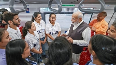 PM Modi interacts with school children at the Regional Rapid Train Namo Bharat in Ghaziabad. (ANI/PIB)