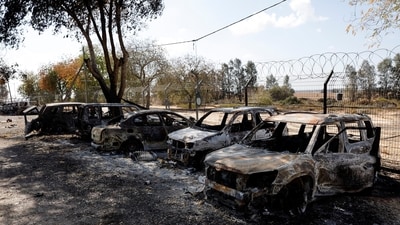 Burnt cars are seen in Kibbutz Nir Oz following a deadly infiltration by Hamas gunmen from the Gaza Strip on October 19. (REUTERS)
