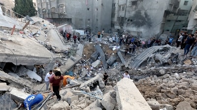 Palestinians search the destroyed annex of the Greek Orthodox Saint Porphyrius Church, the oldest church still in use in Gaza, damaged in a strike on Gaza. (AFP) Palestinians search the destroyed annex of the Greek Orthodox Saint Porphyrius Church, the oldest church still in use in Gaza, damaged in a strike on Gaza. (AFP)