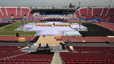 Workers make preparations at the National Stadium ahead of the Pan American Games Santiago 2023 opening ceremony, in Santiago on October 19, 2023. The Pan-American Games will run from October 20 to November 5. (Photo by Raul ARBOLEDA / AFP) (AFP) Workers make preparations at the National Stadium ahead of the Pan American Games Santiago 2023 opening ceremony, in Santiago on October 19, 2023. The Pan-American Games will run from October 20 to November 5. (Photo by Raul ARBOLEDA / AFP) (AFP)