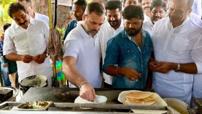 Congress leader Rahul Gandhi on Friday tried his hand at making a dosa at a roadside eatery in Telangana's Jagtial district. (PTI) Congress leader Rahul Gandhi on Friday tried his hand at making a dosa at a roadside eatery in Telangana's Jagtial district. (PTI)