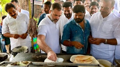 Congress leader Rahul Gandhi makes 'dosa' at a food stall during his visit to Telangana. (PTI) Congress leader Rahul Gandhi makes 'dosa' at a food stall during his visit to Telangana. (PTI)