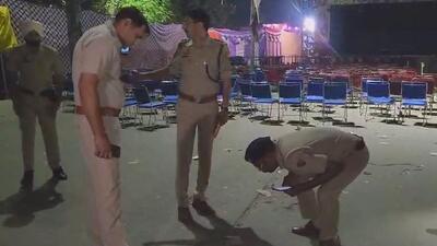 Police investigate the spot where the man was allegedly shot dead near a Ramlila Pandal in Bhim Nagar in Gurugram. (Parveen Kumar/HT PHOTO) Police investigate the spot where the man was allegedly shot dead near a Ramlila Pandal in Bhim Nagar in Gurugram. (Parveen Kumar/HT PHOTO)