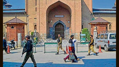Police patrol in front of the mosque after authorities disallowed the prayers in view of the conflict between Israel and Hamas in Gaza, in Srinagar, on Friday. (PTI)