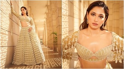 Earlier, Tamannaah shared pictures of her traditional look for Lakme Fashion Week, where she closed the show Vvani by Vani Vats. The designer showcased her collection Piroi and dressed Tamannaah in a lehenga set from the new designs. "Walked for the collection 'Piroi' by @vvanivats at #LakmeFashionWeek," she captioned the post. (Instagram) Earlier, Tamannaah shared pictures of her traditional look for Lakme Fashion Week, where she closed the show Vvani by Vani Vats. The designer showcased her collection Piroi and dressed Tamannaah in a lehenga set from the new designs. "Walked for the collection 'Piroi' by @vvanivats at #LakmeFashionWeek," she captioned the post. (Instagram)