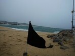 Hurricane Norma: A black flag waves in the wind, signaling a closed beach, prior the arrival of the hurricane Norma in Cabo San Lucas, Mexico. Hurricane Norma: A black flag waves in the wind, signaling a closed beach, prior the arrival of the hurricane Norma in Cabo San Lucas, Mexico.