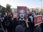 Bahrainis carry placards during a gathering in Manama on October 20, 2023, to express their solidarity with the Palestinian people. (AFP) Bahrainis carry placards during a gathering in Manama on October 20, 2023, to express their solidarity with the Palestinian people. (AFP)