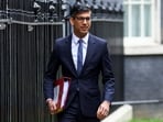 British Prime Minister Rishi Sunak walks at Downing Street in London, Britain.