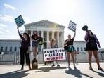 Anti-abortion rights demonstrators outside the US Supreme Court in Washington, DC, US, on Friday, April 21, 2023. The Supreme Court extended a temporary hold on new restrictions imposed by a federal judge in Texas on a widely used abortion pill, giving the justices until today to decide how to handle the case. Photographer: Valerie Plesch/Bloomberg Anti-abortion rights demonstrators outside the US Supreme Court in Washington, DC, US, on Friday, April 21, 2023. The Supreme Court extended a temporary hold on new restrictions imposed by a federal judge in Texas on a widely used abortion pill, giving the justices until today to decide how to handle the case. Photographer: Valerie Plesch/Bloomberg